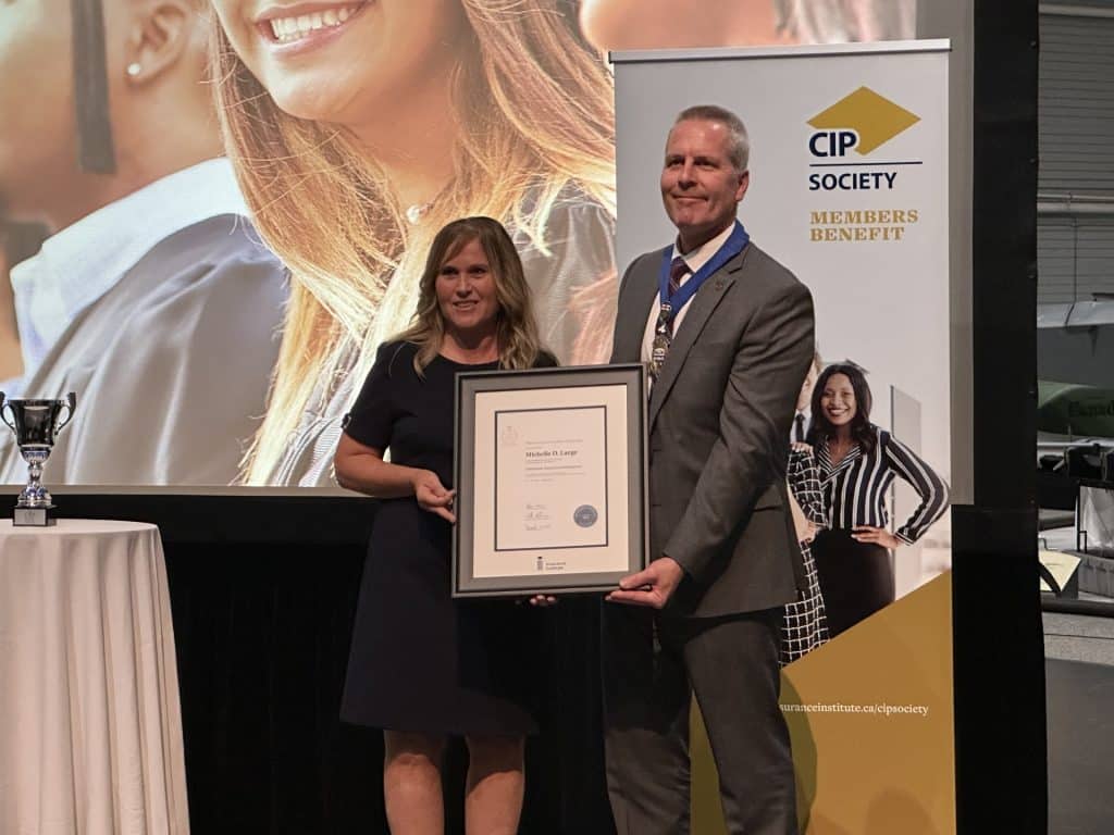 Michelle Large collecting her certificate at the CIP Graduation Ceremony