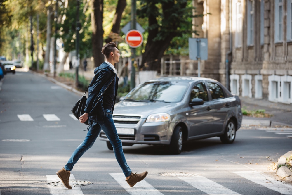 young-man-cross-street