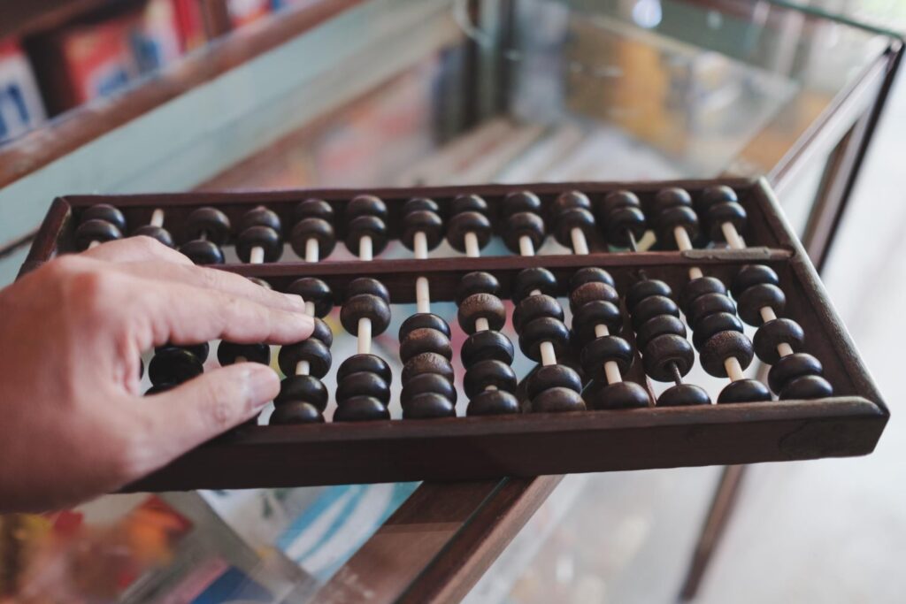 Cropped hand playing abacus